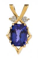 Exceptional Ladies 14K Yellow Gold pendant with a 6.28 Carat Oval Tanzanite Accented with Two (2) 10 pt. Diamonds